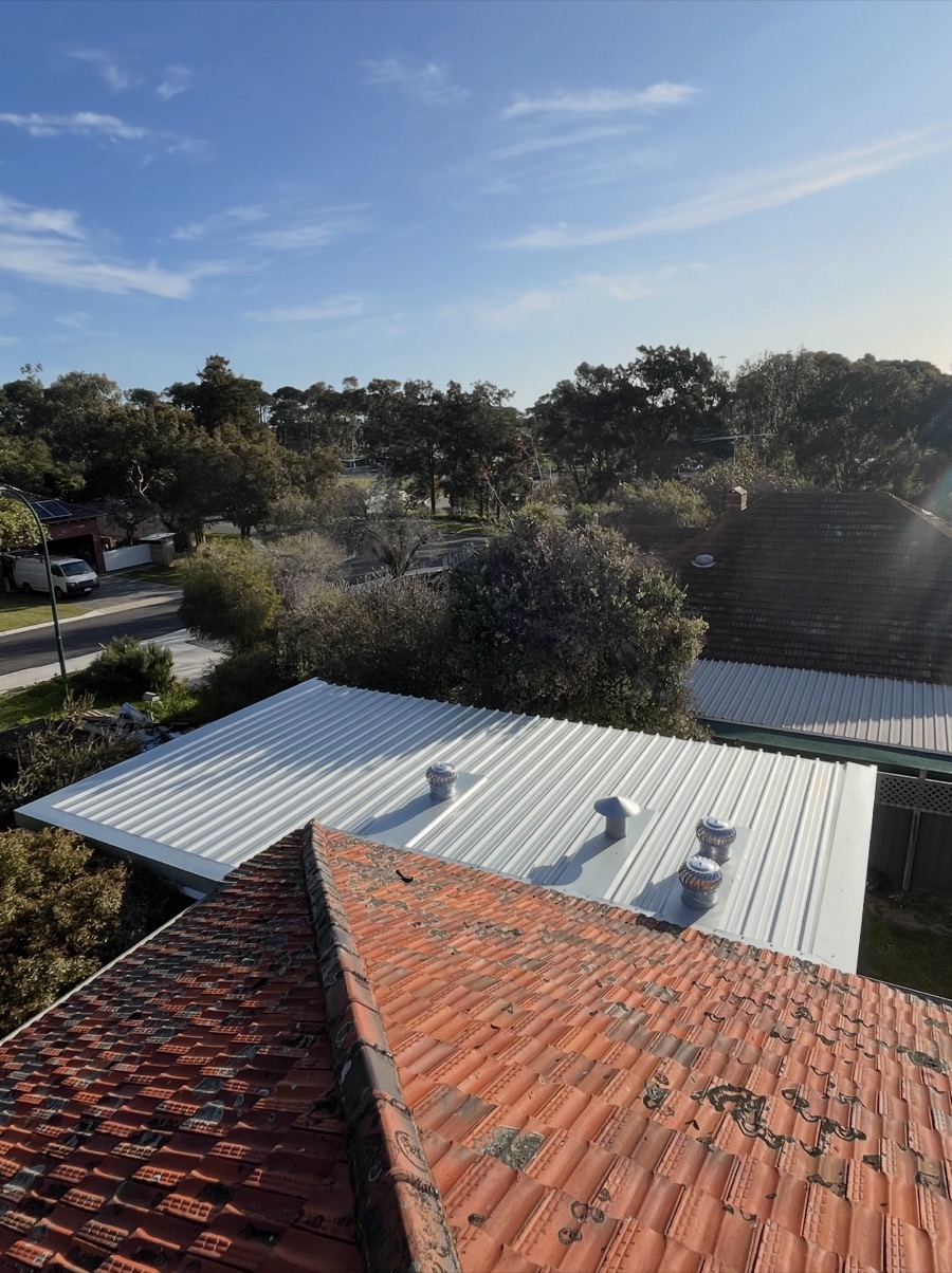 After: New metal sheets with whirlybirds and vents