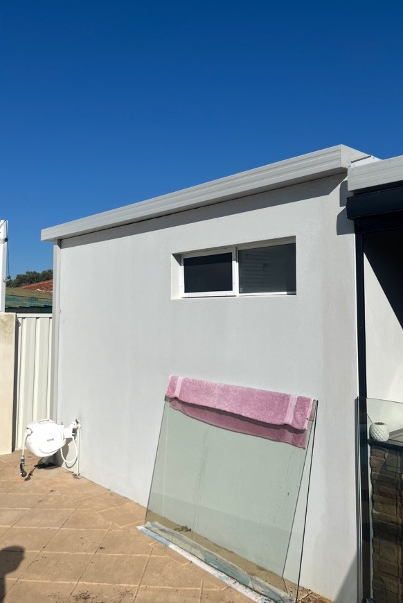 After: New gutter and a clean wall