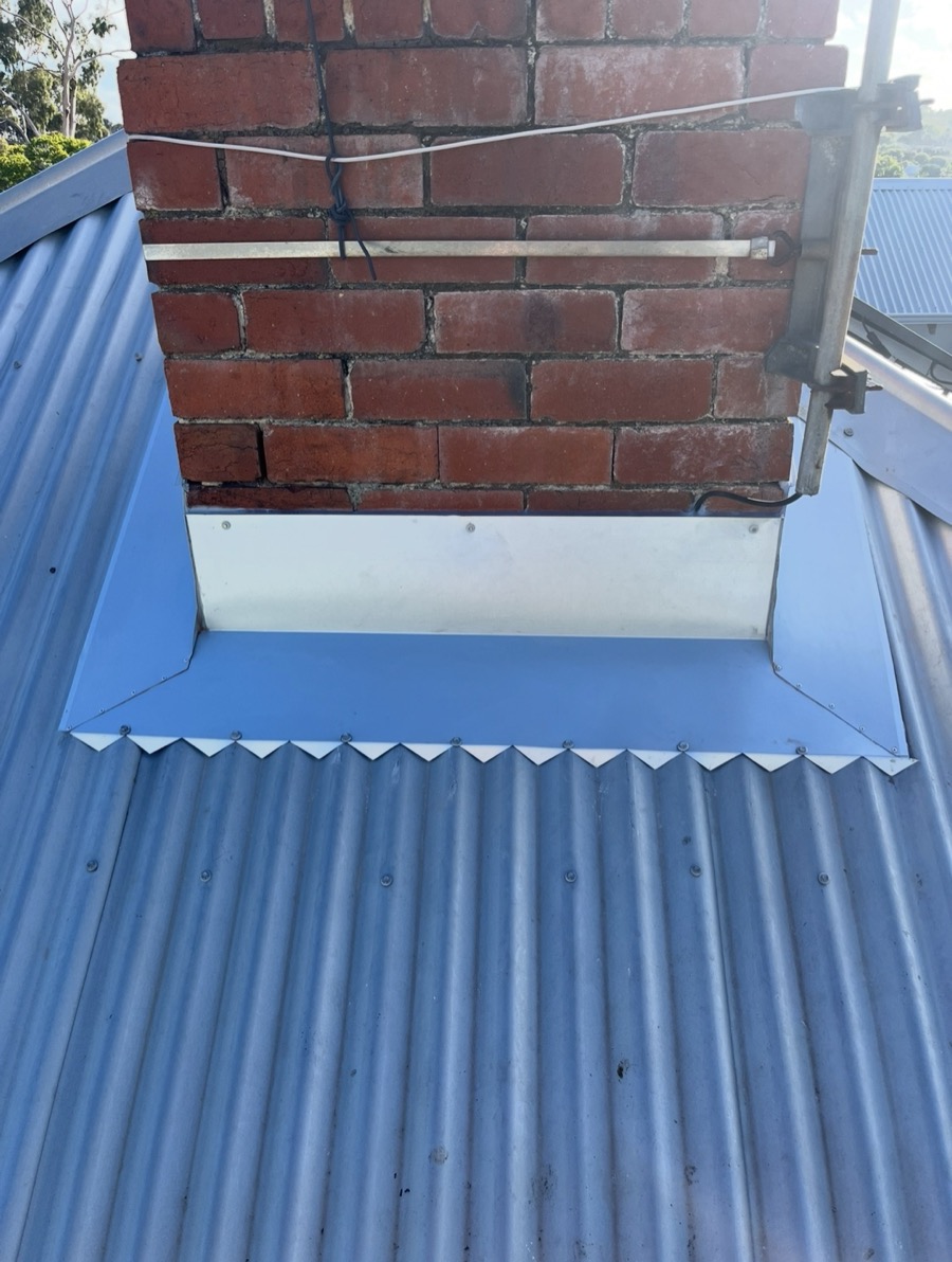 After: New folded apron flashing around the chimney