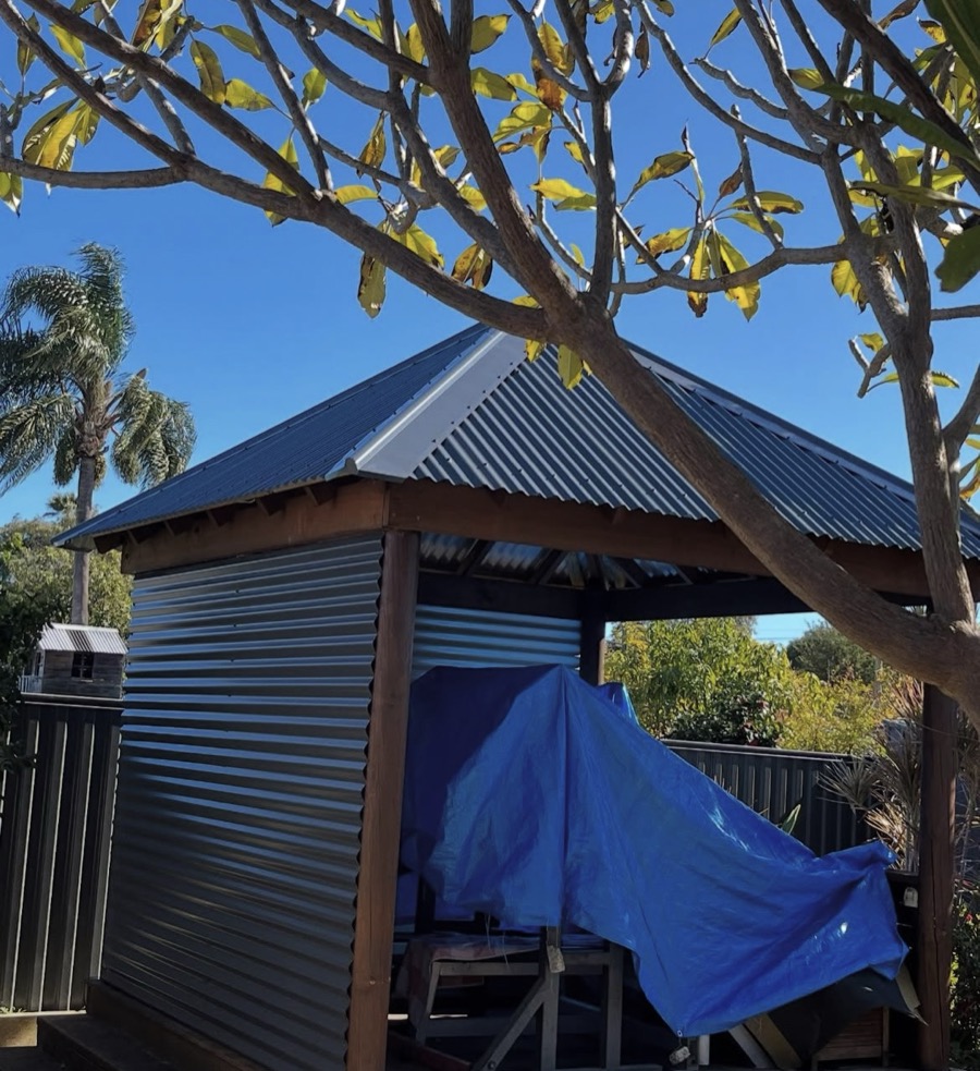 After: The same gazebo with a new metal roof and wall sheets