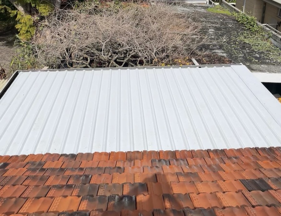 After: New white roof sheeting in place of the rusted sheets