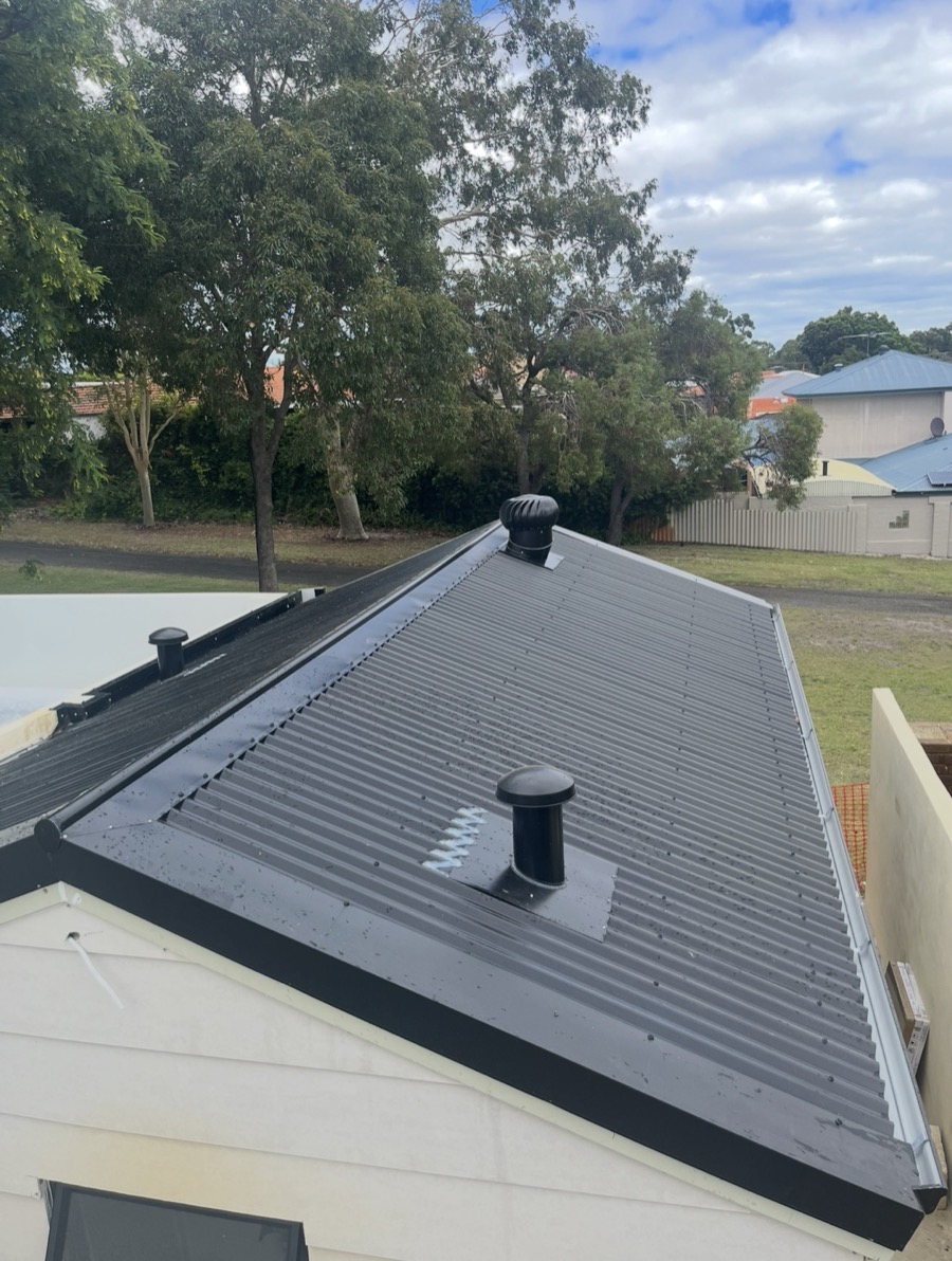 Finished black roof with vents and whirlybird
