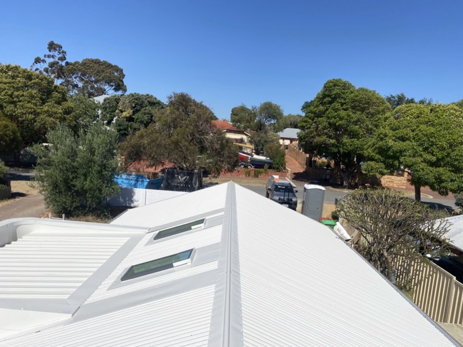 New metal roof with skylights and ridge capping