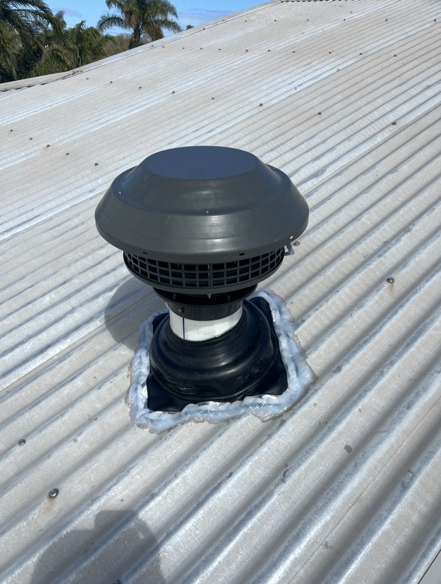 New roof vent sealed with a flashing boot